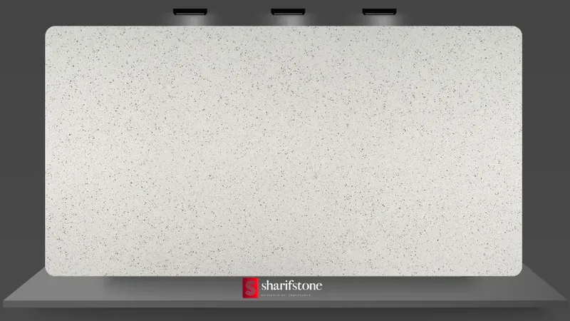 Ice-white quartz slab sample with dense fine black speckles