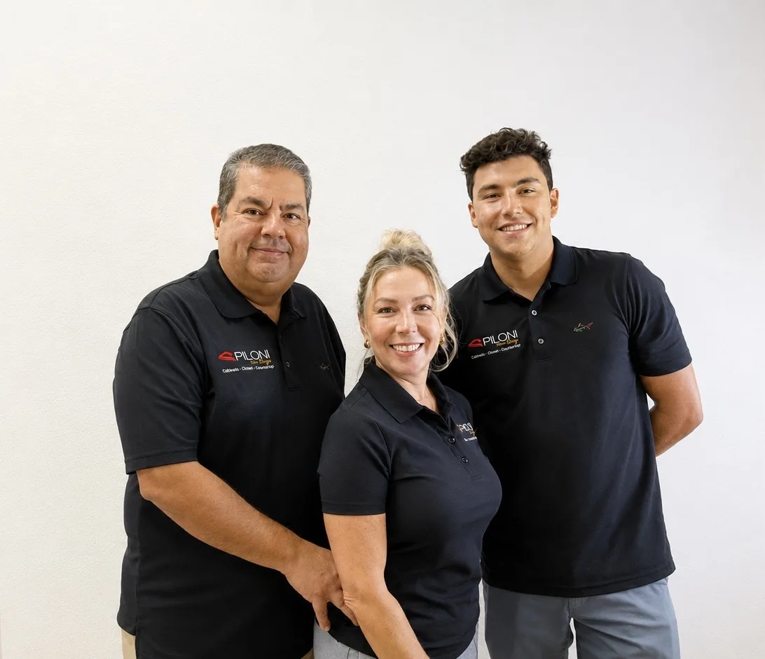 Three members of the Piloni Home Design team in company polo shirts